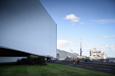 Two engineers walk past a vast wind turbine blade testing building, at the Catapult Innovation and Research Centre for Offshore Renewable Energy. The former coal mining area of Blyth in the North East...