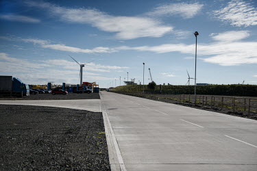 A wind turbine stands across the road from the now closed site of the former Bates coal mine, at what is now Bates Terminal, which is being transformed into a clean energy terminal at the Port of Blyt...