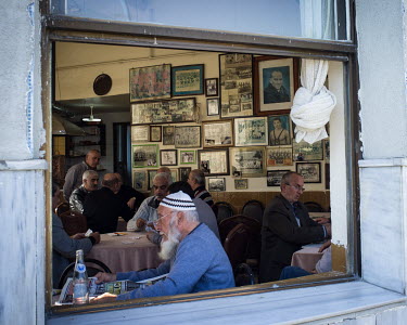 Mustafa Kemal Ataturk's portrait joins those of wrestlersand other figures in a cafe in the Balat neighbourhood.