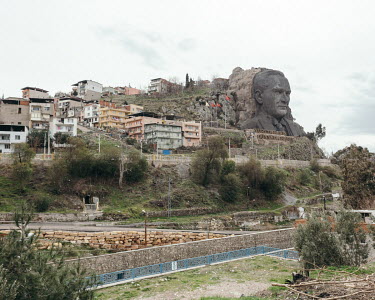 An artificial rock sculpture of Mustafa Kemal Ataturk on theside of a hill.
