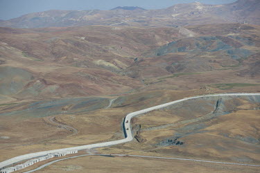A newly constructed Turkish border wall snakes through the mountains along the border with Iran. It has been built as part of an attempt to prevent increasing numbers of Afghans from illegally crossin...