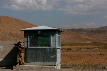 A member of the Turkish Jandarma forces at a checkpoint near the border with Iran. A newly constructed border wall has been built as part of an attempt to prevent increasing numbers of Afghans from il...