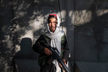 Saif Ulkhaled, a young Taliban, guarding the entrance to the District 10 Police Centre.