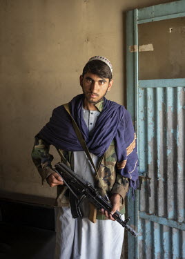 A Taliban poses at the entrance to the Kabul stadium.