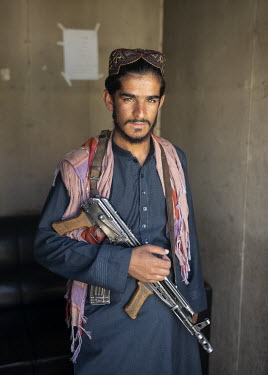 A Taliban poses at the entrance to the Kabul stadium.