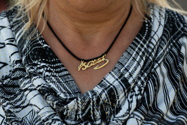 An ex-resident of Ataturk Koyu, near Damla on Turkey's border with Georgia wears a necklace with Mustafa Kemal Ataturk's signature.