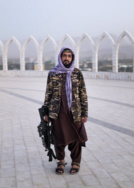 A Taliban poses at the top Wazir Akbar Khan hill.