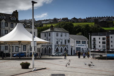 People walk through the town of Whitehaven where plans for a new coal mine on the site of a former chemical company have caused controversy. West Cumbria Mining hopes to mine up to 2.78 million tonnes...