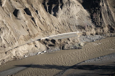Flood water runs along destroyed sections of Highway 8, near Spences Bridge. Unprecedented rainfall throughout the province triggered landslides and devastating flooding on 14 November 2021, leaving c...