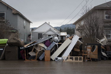 Personal belongings discarded in front of a flood damaged home. Unprecedented rainfall throughout the province triggered landslides and devastating flooding on 14 November 2021, leaving countless peop...