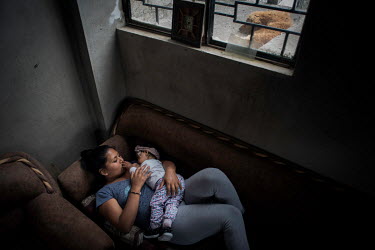 'Eli' at home taking care of her daughter. In 2017 her husband was detained for drug trafficking. After this she assumed sole responsibility for the upbringing of her daughter and the maintenance of h...