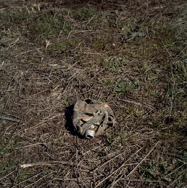 A military flask discarded on the side of a rural road an area retaken by Azerbaijani forces, from Armenian control, in November 2020 during the Nagorno-Karabakh war.
