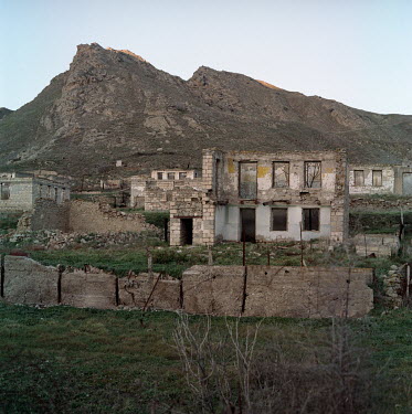 Destroyed homes on the bank of the Aras river, marking Azerbaijan's border with Iran. The Khodafarin Bridge, (behind camera), connects Iran with Jebrail, one of the provinces recently reclaimed by Aze...