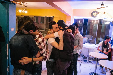 Hussein (C) dances with his boyfriend at his birthday party, at a gay friendly cafe in central Istanbul.