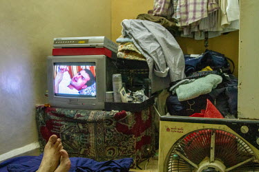 'Bissam' is a gay Iraqi actor and former US army translator. Here 'Bissam' watches a Syrian TV series (much like the Iraqi series he used to act in back in Baghdad) in his cramped rented room in the o...