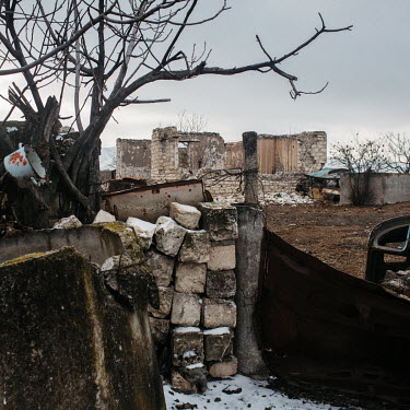 Destroyed homes and signs of life in a village in Agdam province, an area retaken by Azerbaijani forces, from Armenian control, in November 2020.