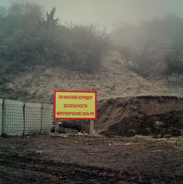 A warning sign at a Russian military checkpoint at the Lacin corridor, a small area under Armenian control. Russian peacekeeping forces were deployed to the area after Russia brokered a peace agreemen...