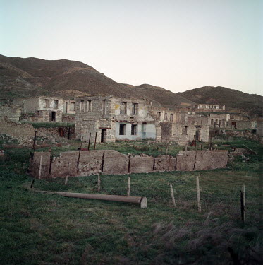 Destroyed homes on the bank of the Aras river which marks Azerbaijan's border with Iran. Azeri forces re-took the area from Armenian control during the 2020 Nagorno-Karabakh war.