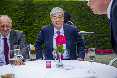 Kassym Jomart Tokayev (centre) at a diplomatic event when he was Director General of the United Nations in Geneva.
