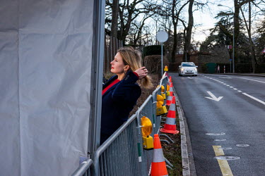 TV journalist ready to go live, part of the International press reporting from outside the US Mission in Geneva, as Russian and US diplomats hold talks over tensions in Ukraine.