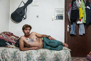 'R' is a gay Iranian refugee who was granted asylum in the UK, where his elder sister lives. Here he lies on his bed at home in his apartment in Isparta, where he spent more than two years whilst wait...