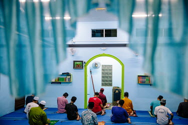 Prayer time in the evening at the local mosque (surau) in Muar.