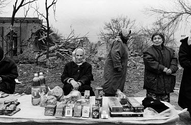 Women try to make ends meet by selling cigarettes, coffee, sweets and soft drinks on the streets of Grozny.