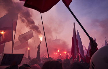 Thousands people carrying Polish flags and lit flares during a rally organised by the far-right on National Independence Day.