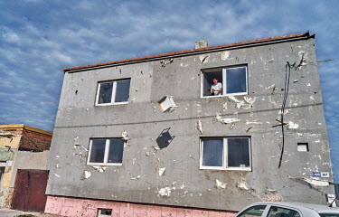 Volunteers clean up a damaged building which was hit by a deadly tornado which swept through several villages in South Moravia on 24 June 2021, killing seven people and leaving about 200 injured.