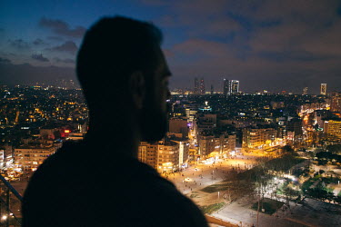 F', a gay man from Damascus, Syria, on a rooftop above Taksim Square in Istanbul. This image is from a series of Syrian and Iraqi gay men on rooftops in Istanbul, as a sign of life and defiance agains...