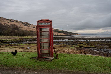 A telephone box looks over the bay at Kinloch, the only inhabited village on the island.