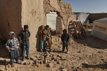 Children in what remains of their family home in the Bolan area of Lashkar Gah city.