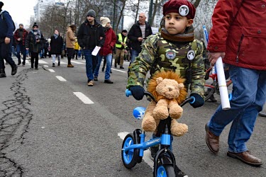 A child in military attire. Approximately 20,000 to 25,000 people, across Europe, came to Brussels to protest against coronavirus regulations such as the QRcode, mandatory vaccinations, Pass Sanitaire...