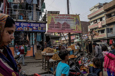 An advertising banner in a market appealing for financial donations for the creation of Ram temple in Ayodhya.