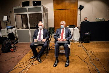 In a basement of the Hotel President Wilson, while Russian foreign minister Sergei Lavrov gives a press conference the Russian Ambassador in Geneva and his chief negotiator sit at the back of the room...