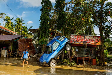 A 4x4 vehicle left on its nose in the aftermath of typhoon Rai.