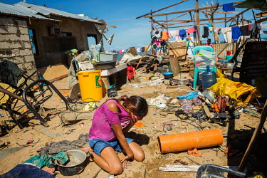 Marites Pungkol (28), overwhelmed and distraught by the realisation that she has lost everything in the aftermath of typhoon Rai, breaks down and cries outside her tiny shelter in Barangay Tapon. The...