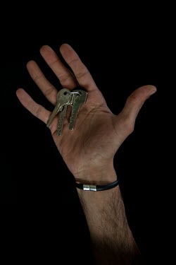 Mohammed, 33, with the keys to his home in Idlib that he fled 2 years 4 months previously. He describes his home as "stability".  Syrian Nakba, Keys of home. The front-door keys to the homes of some o...