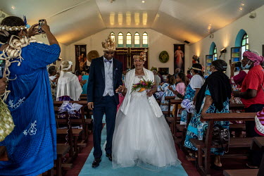 Jacques Atti (42), from the Touaourou Tribe, and Sabrina Manique (42), from Lifou Island, during their wedding ceremony in a Catholic Church during a 'Kanak' clan wedding in Goro. Both used to work at...