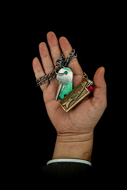 Nassif. 30, with the keys to his home in Homs that he fled 2 years previously. He describes his home as ^I feel bare without it^.~~Syrian Nakba, Keys of home.~The front-door keys to the homes of some...