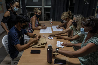 People count ballots after the polling stations closed in the 2021 independence referendum.