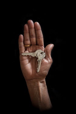 Waffa, 54, from Latakia with the keys to her home from where she fled 2.5 years previously. She describes her home as "my sons, my daughters, my family".  Syrian Nakba, Keys of home. The front-door ke...