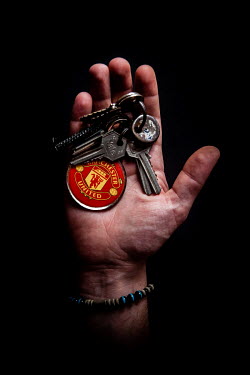 Hael, 28, with the keys to his home in Deir Ezzor/Damascus that he fled 1 year, 4 months, 10 days previously. He describes his home as ^Love^ and ^My nest^.Syrian Nakba, Keys of home.The front-door ke...