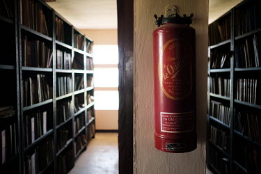 A fire extinguisher with a 'last tested' date of September 1956 on a wall in the library at the National Institute for Agronomic Study. During the Belgian colonial period the institute was one of the...