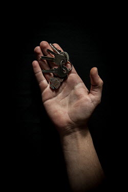 Fareed, 23, with the keys to his home in Hama that he fled 1 year 4 months previously. He describes his house as ^home^.Syrian Nakba, Keys of home.The front-door keys to the homes of some of the estim...