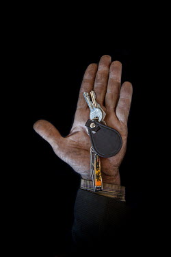 Hassan, 59, with the keys to his home in Sheikh Saied, Aleppo that he fled 1 year, 5 months previously. He describes his home as ^I'm like a bird; however much I travel, I always want to return home^....