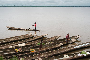 Pirogues moored along the banks of the River Congo on market day in Yangambi in the Democratic Republic of Congo.