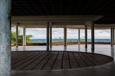 The stripped dance floor of a former resort along the Congo River on the grounds of the Yangambi research station. The building once housed a bowling alley in the basement; today squatters live in its...