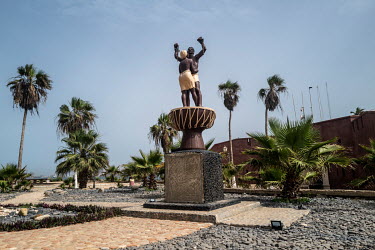 A statue of freed slaves on Place la Liberte on the historic Goree Island, infamous for its prison, the departure point for enslaved Africans being transported across the Atlanic Ocean to the plantati...