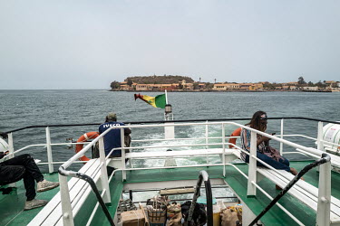 A ferry boat leaving the historic Goree Island, infamous for its prison, the departure point for enslaved Africans being transported across the Atlanic Ocean to the plantations of the Americas.